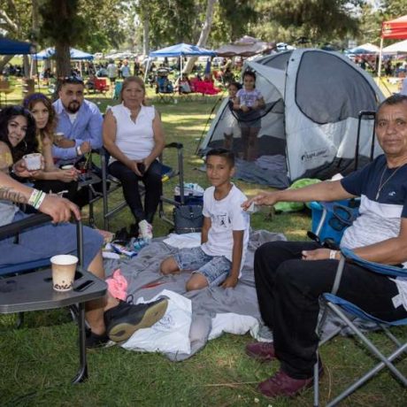 people smiling together at park for photo