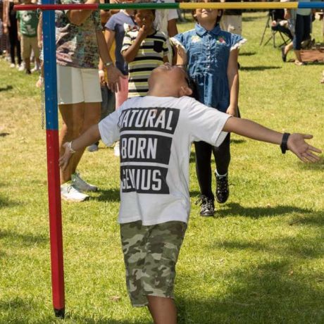 kid playing limbo