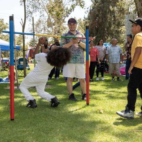 people playing limbo at park