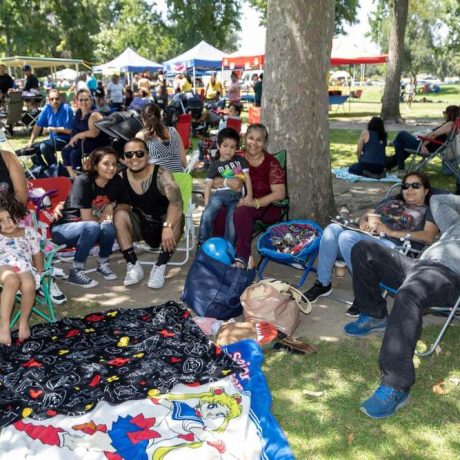 people smiling together at park for photo