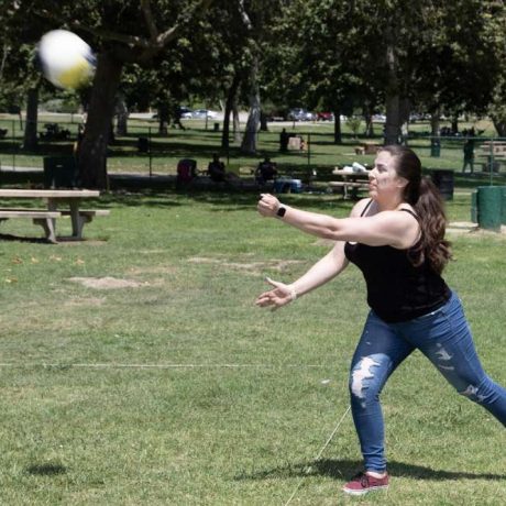 woman playing volleyball at park
