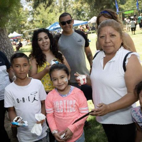 people smiling together at park for photo