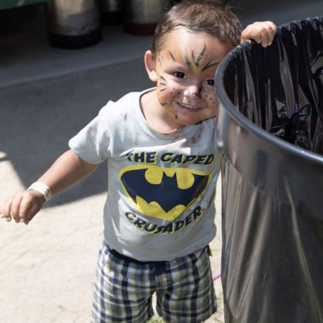 smiling child with face paint