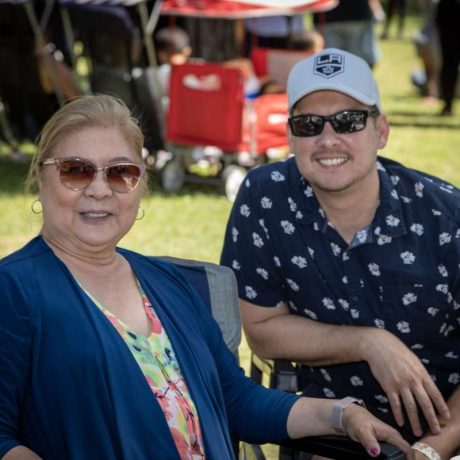 people smiling together for photo on a sunny day