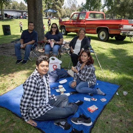 people smiling together at park for photo