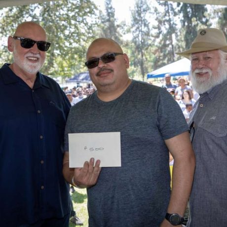 man recieving envelope smiling