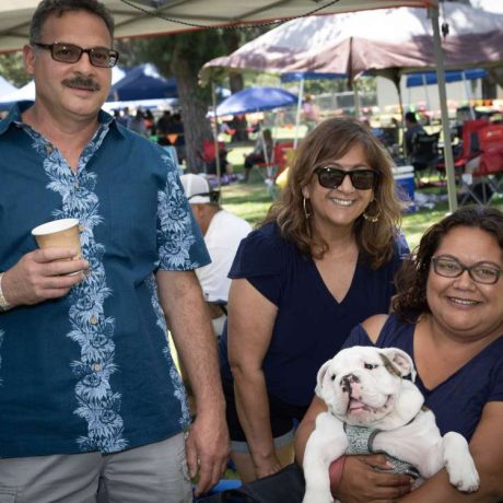 people smiling together at park for photo