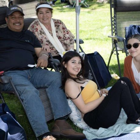 people smiling together at park for photo