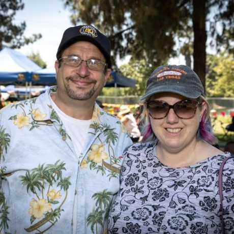 people smiling together at park for photo