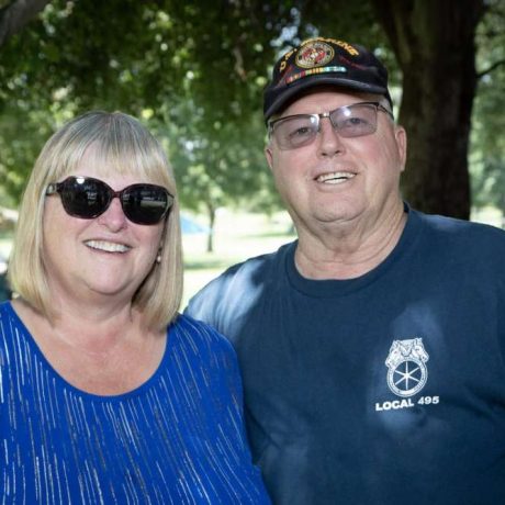 people smiling together for photo at park