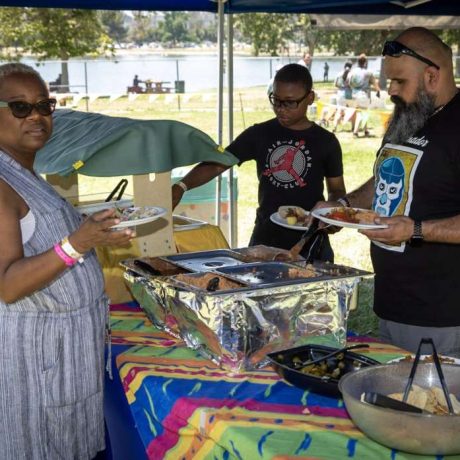 people getting food at picnic