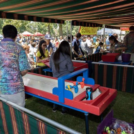 families lined up for games at park