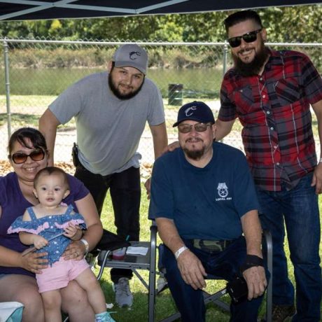 people smiling together at park for photo