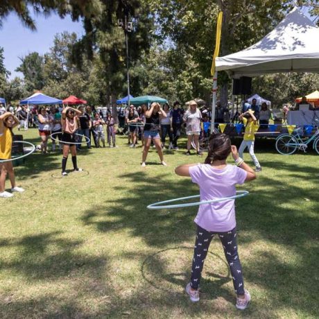 people hula hooping in park