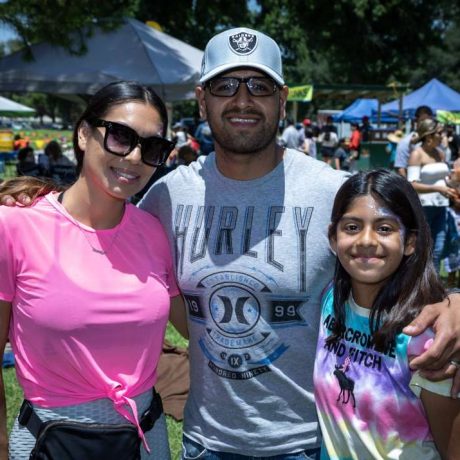 people smiling together at park for photo