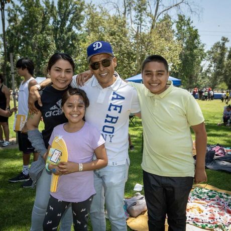 people smiling together at park for photo