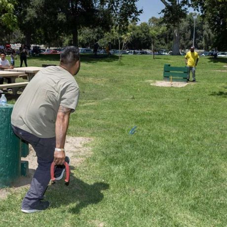 man playing horseshoes