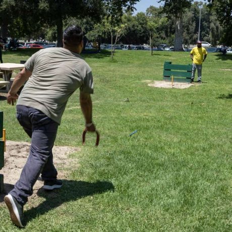 man playing horseshoes