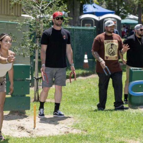 people playing horseshoes