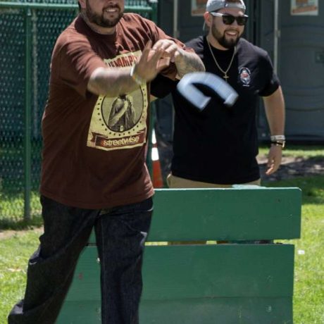 men playing horseshoe toss