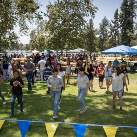 people lined up for games at park