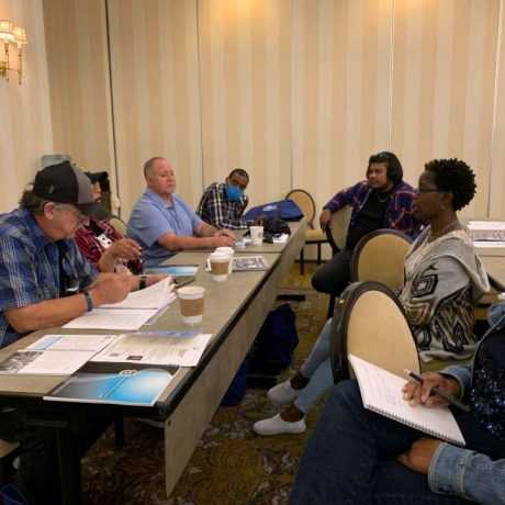 group of people reviewing and discussing documents together