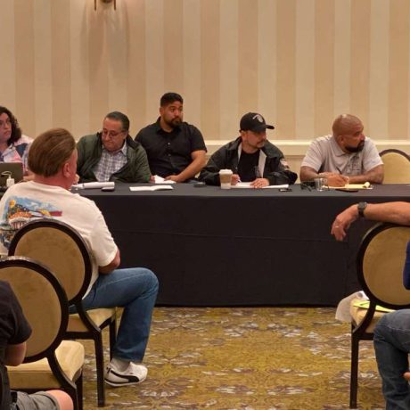 panel of people sitting together at table