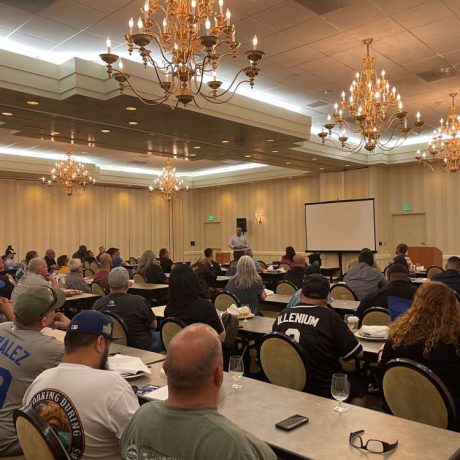 people watching presentation in large room