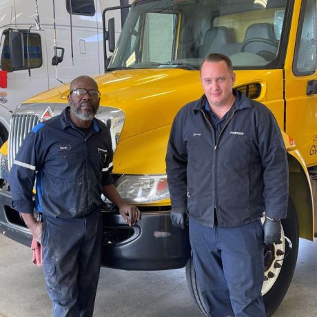 men standing in front of truck in uniform