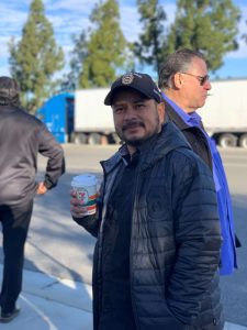 man smiling with coffee