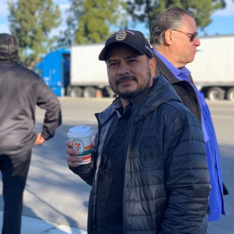 man smiling with coffee