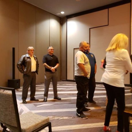 people at meeting in a large room