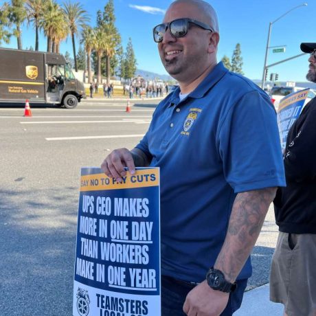 man holding rally signage