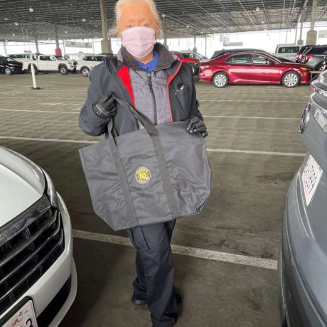 teamster holding teamster branded bag