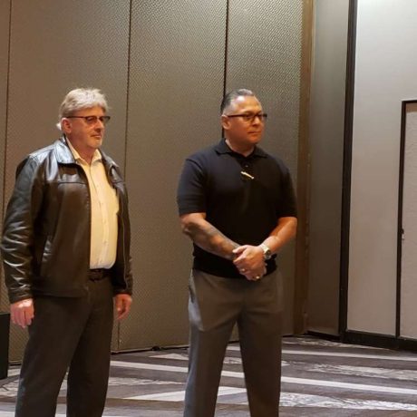 men standing in meeting room