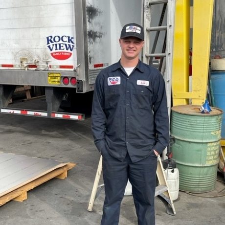 man standing in front of truck