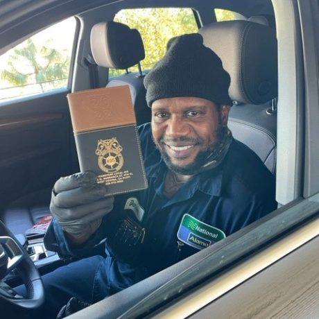 man holding booklet