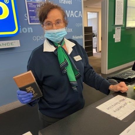 woman holding booklet