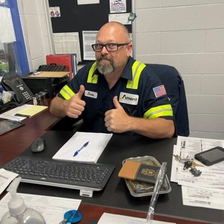 man giving thumbs up while working