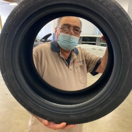 man holding tire