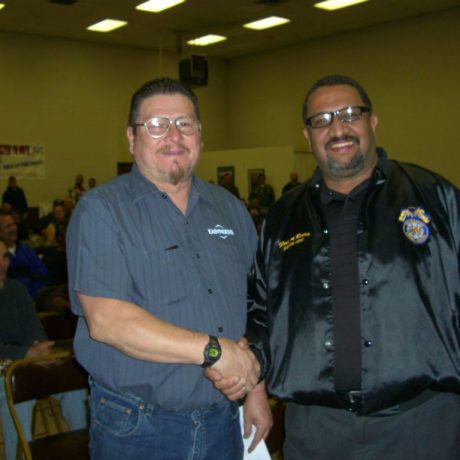 men shaking hands at meeting