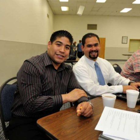 people smiling together while working