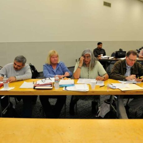 group of people reviewing paperwork