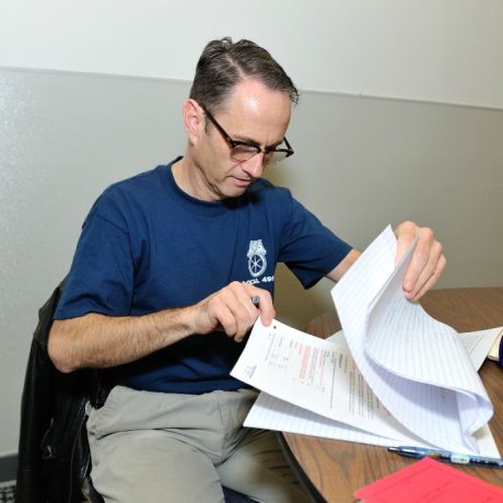 man checking documents