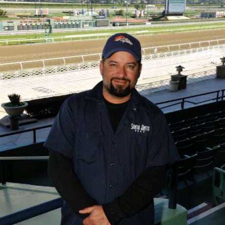 man standing in front of racetrack