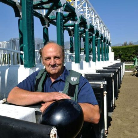 man on racetrack with tractor