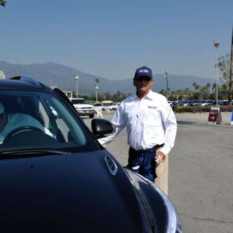 man getting into car