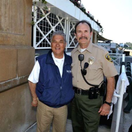 man and law officer posing for photo smiling