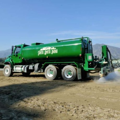 large truck spraying down racetrack