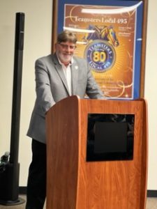 man speaking at podium